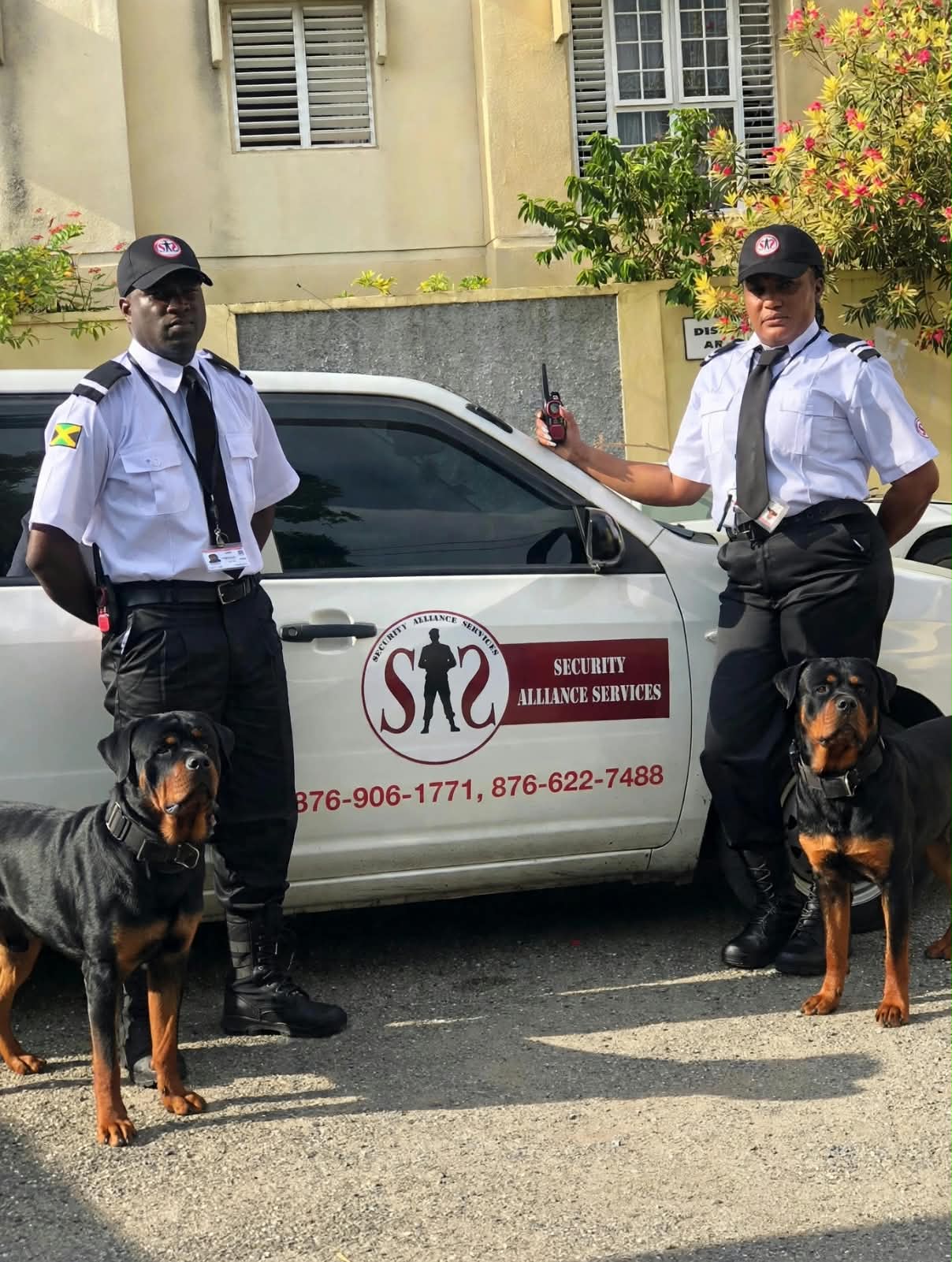 SAS officers and K9 teams beside a patrol vehicle